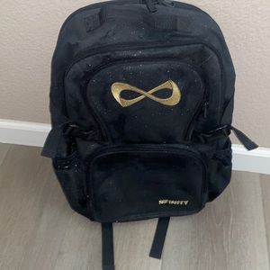 NEW NFINITY BACKPACK GOLD AND BLACK SPARKLY